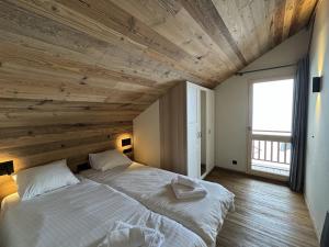 Ένα ή περισσότερα κρεβάτια σε δωμάτιο στο Chalet Schuss