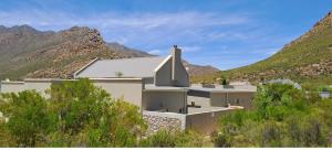 a building in the middle of a mountain at Sage in Montagu