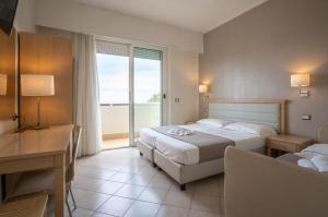 Postel nebo postele na pokoji v ubytování Hotel Adriatic&Beauty + 37 fotografií