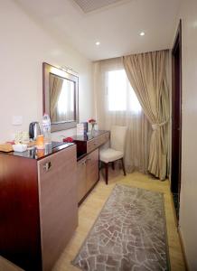 Voodi või voodid majutusasutuse Cairo Taj Hotels & Suites - Dokki toas