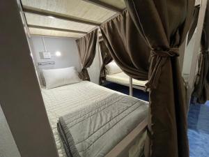 Postel nebo postele na pokoji v ubytování Zou Hostel