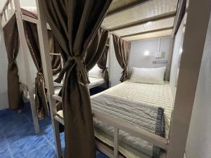 Postel nebo postele na pokoji v ubytování Zou Hostel + 11 fotografií