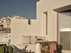 a white room with a table and a view of a city at Ark in Pirgos
