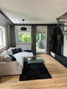 a living room with a couch and a table at Messners Ferienhaus in Löllinggraben