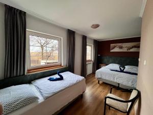 Postel nebo postele na pokoji v ubytování M1 Laczházy Hotel Coffee & More