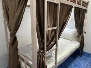 Postel nebo postele na pokoji v ubytování Zou Hostel
