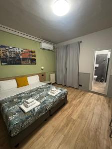 Postel nebo postele na pokoji v ubytování Hotel Camilla Guelfa