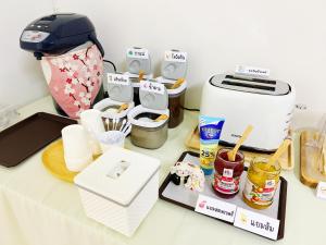 a kitchen counter with a toaster and other kitchen items at ชาโตว เรสซิเดนซ์ Chateau Residences in Ban Khlong Nung +3 photos
