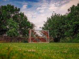 a soccer goal in the middle of a field at Ferienhaus Bollhagen in Neuhof