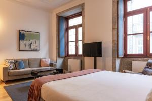 Uma televisão e/ou sistema de entretenimento em UMA Foyer 25 Apartments