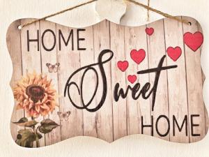 a sign that says homeived with hearts and a sign that says homeived at Antica Pietra in Polignano a Mare