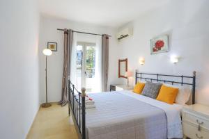 Postel nebo postele na pokoji v ubytování Angela Apartment