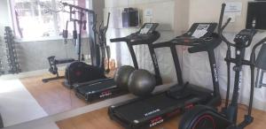 a gym with several exercise bikes in a room at Studio 6677 Aptº302 Em frente ao Projac da Globo in Rio de Janeiro