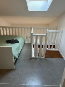 a bedroom with a bunk bed and a staircase at Le Cocon de la Grande Rue in Tournon-sur-Rhône +8 photos