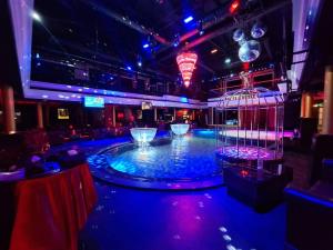 a room with a pool in the middle of a dance floor at Climax Berlin in Pattaya Central