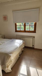 Ένα ή περισσότερα κρεβάτια σε δωμάτιο στο dpto aldea de motaña