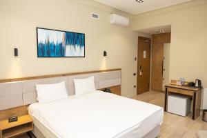 Кровать или кровати в номере Hotel Marwa Tashkent Pool&Spa