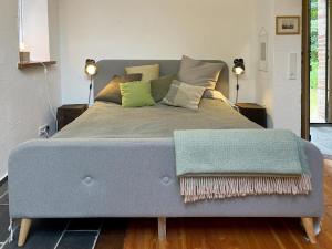 a bedroom with a bed with a blue bed frame at grün in grün in Detmold