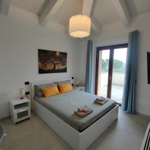 Postel nebo postele na pokoji v ubytování Agriturismo Giorgini