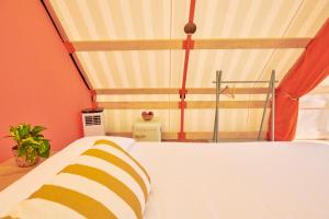 Postel nebo postele na pokoji v ubytování LAVITA Camp - Capitana Villasimius