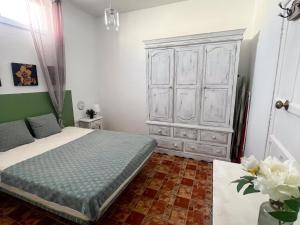 Ένα ή περισσότερα κρεβάτια σε δωμάτιο στο Casa Gattone Adeje Los Menores +2 φωτογραφίες