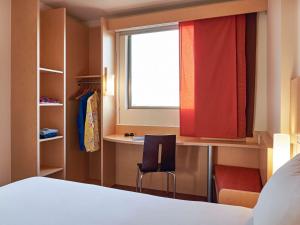 Cama ou camas em um quarto em Ibis Cancun Centro