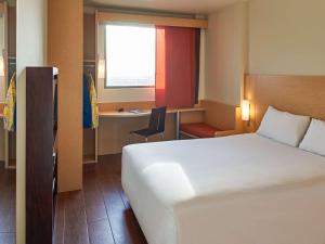 Cama ou camas em um quarto em Ibis Cancun Centro