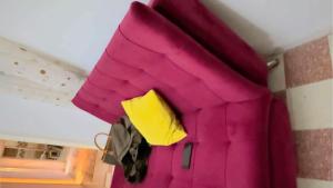 a pink coat hanging on the ceiling of a room at La Maison De Bonheur in Tunis