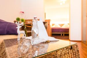 a table with two glass bottles on top of it at Landgasthof Hirschen GbR in Hohentengen