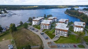 an aerial view of a building next to a river at Apartamenty Iława - Marina in Iława