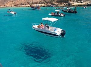 a group of boats in a large body of water at Doria 18 in Lampedusa +17 photos