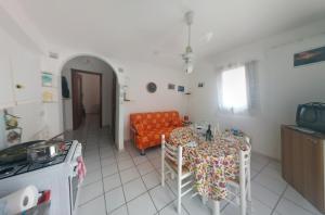 a living room with a table and a couch at Doria 18 in Lampedusa