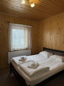 Postel nebo postele na pokoji v ubytování Маріна Драгобрат