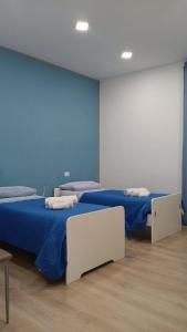A bed or beds in a room at Renovated Loft with Vesuvio view terrace