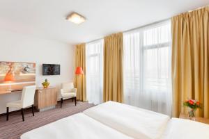 Postel nebo postele na pokoji v ubytování Akcent hotel + 37 fotografií
