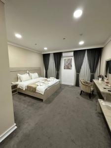 Postel nebo postele na pokoji v ubytování South Hotel Tashkent