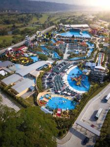an aerial view of a water park with many pools at Quiin Home cozy modern house in Pampang