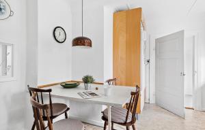a dining room with a white table and chairs at Stunning Home In Sydals With Wifi in Bro