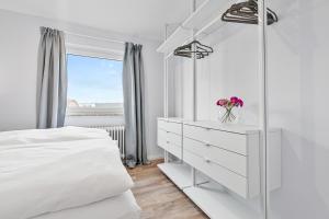 Voodi või voodid majutusasutuse CLS Strand City-Wohnung im Zentrum von Grömitz mit Balkon und Parkplatz, alles in 5 Minuten erreichbar Restaurants, Bäckerei Junge, Strand, Frisör, Massage, ideale Anbindung Schön Klinik Neustadt toas