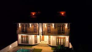 a model of a house with a pool in front of it at Villa Elegant Oasis in Horana