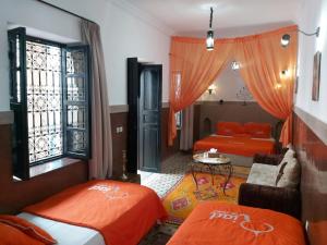 Postel nebo postele na pokoji v ubytování Riad Ciel d'Orient