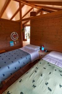 Postel nebo postele na pokoji v ubytování Glamping Stregaia