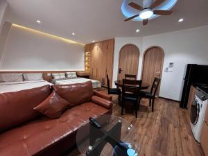 a living room with a couch and a table at Wabi Homes in Buon Ma Thuot