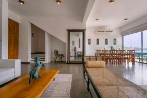 a living room with a couch and a table at Charlie in Ambalangoda