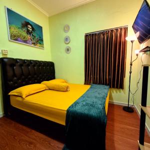 Postel nebo postele na pokoji v ubytování Ardian House Jepara + 20 fotografií