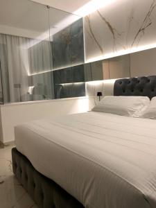 Ένα ή περισσότερα κρεβάτια σε δωμάτιο στο Bellini Luxury Suite Superior