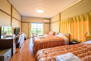 Kashikojima Hotel Bay Garden客房内的一张或多张床位