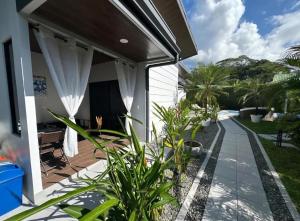 a patio with plants in front of a house at MADRE TERRA in Uvita