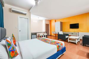 Rúm í herbergi á FabHotel Cosmo Annora - Nr Domlur
