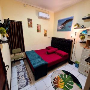 Postel nebo postele na pokoji v ubytování Ardian House Jepara